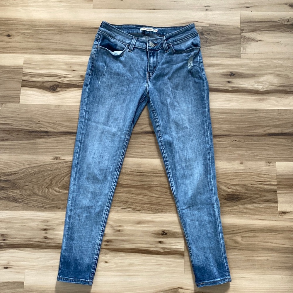 Women Levi jeans. Rarely worn. Photos are a little darker than original color.